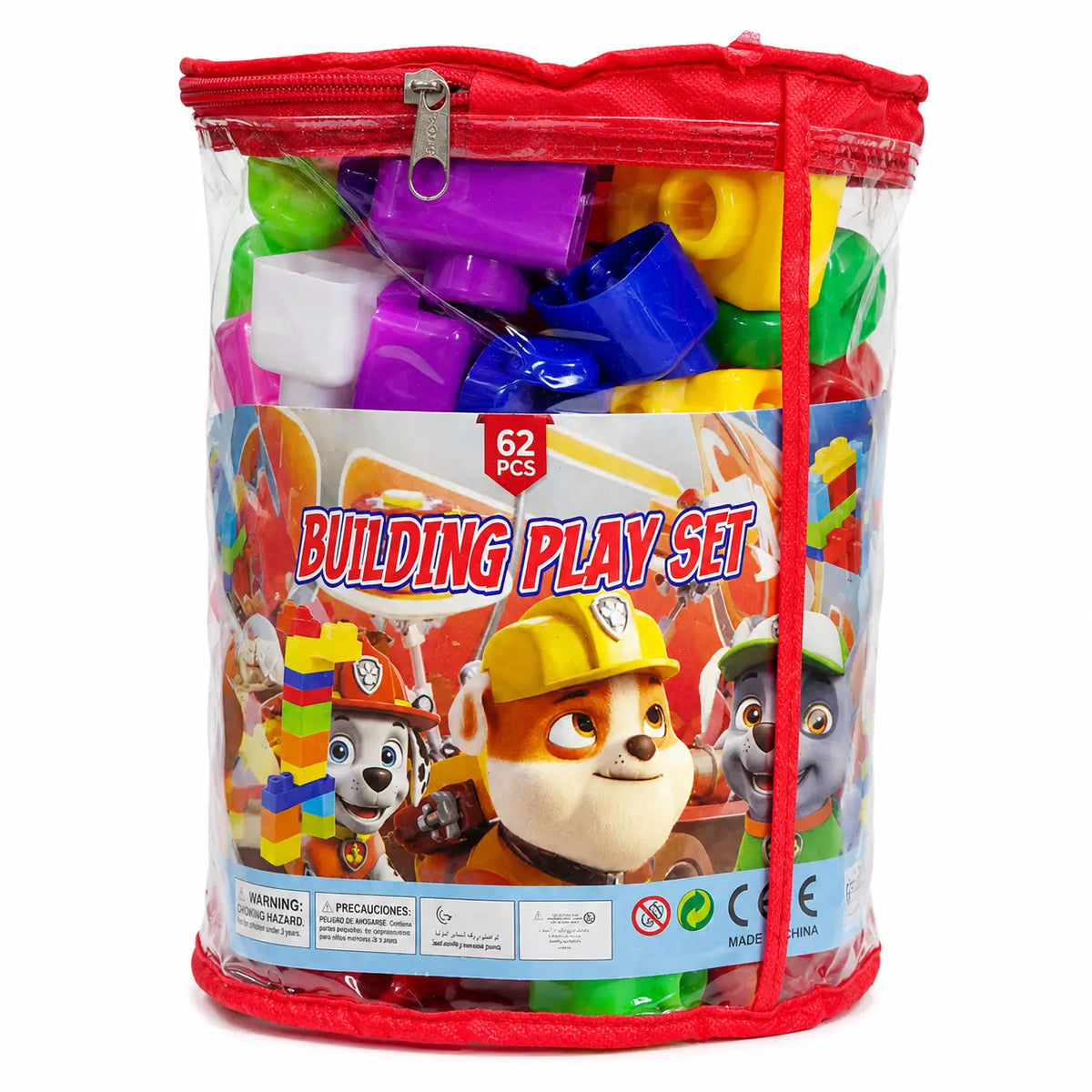 A clear cylindrical zippered storage bag containing a colorful building play set. The bag has a red zipper and trim, with a front label showing Paw Patrol characters and the text '62 PCS BUILDING PLAY SET'.
