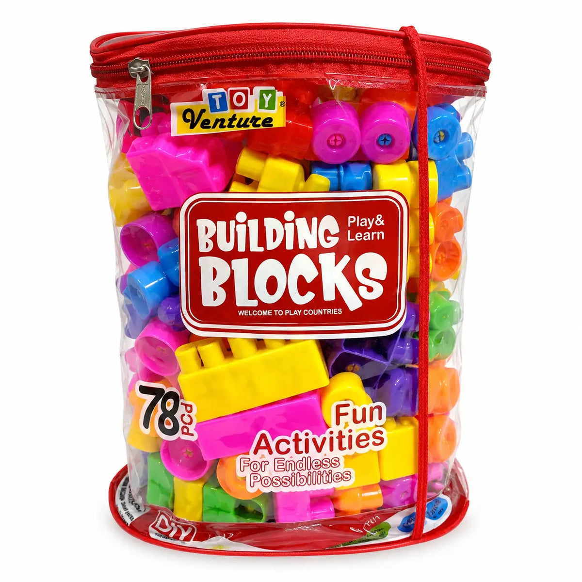A clear cylindrical zippered storage bag filled with colorful plastic building blocks, with a red zipper and a large front label reading 'Building Blocks' and 'Toy Venture'.