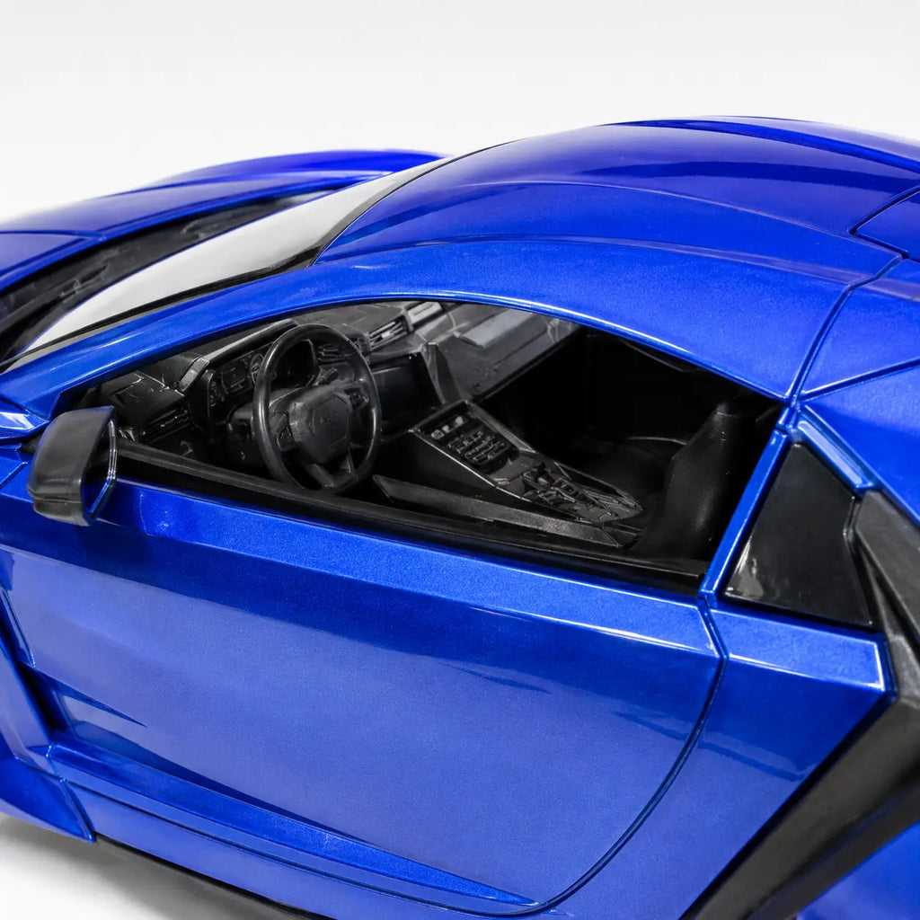 Close-up view of the detailed black interior and dashboard inside the blue Bonzer RC car
