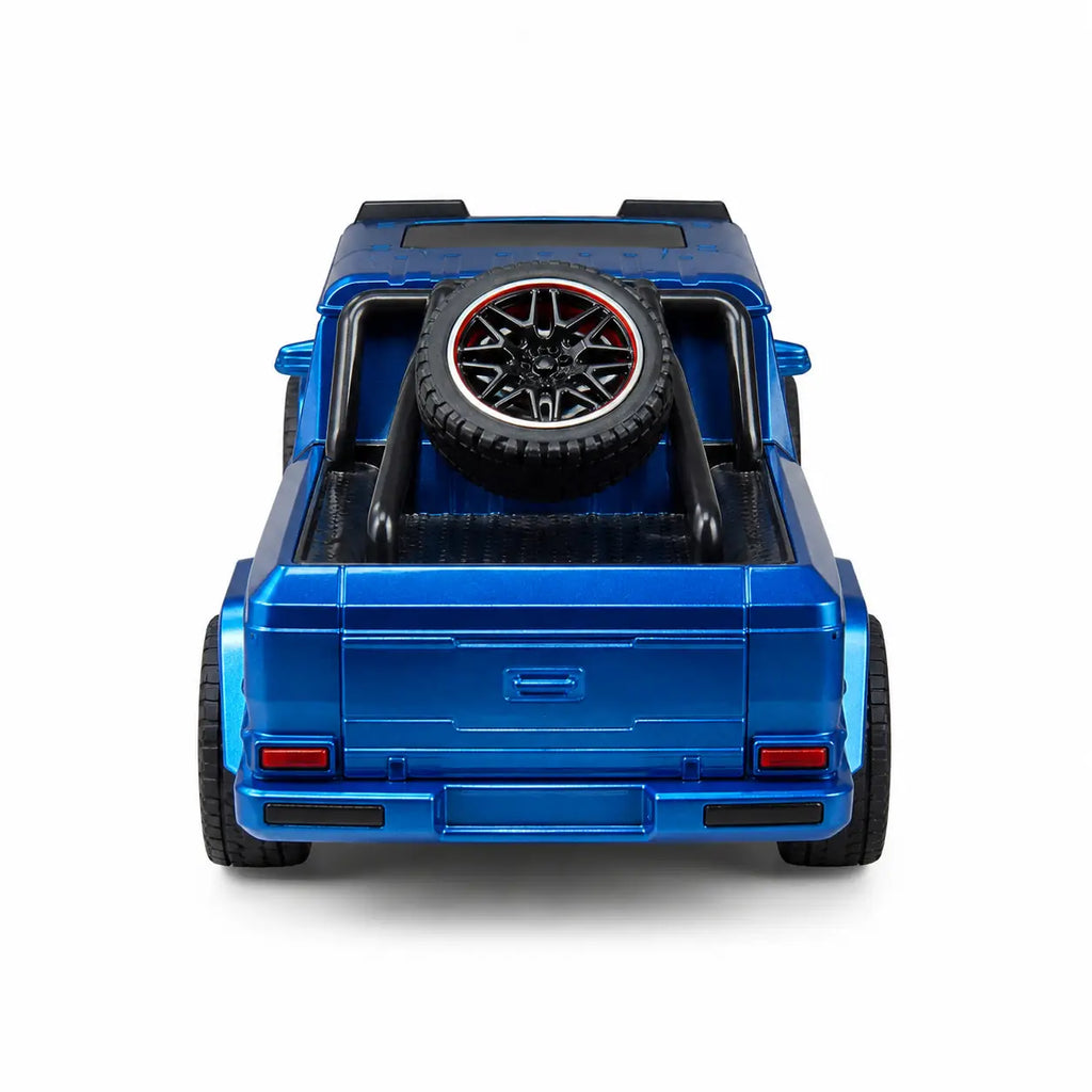 Rear view of blue RC pickup truck with open pickup bed and spare wheel design