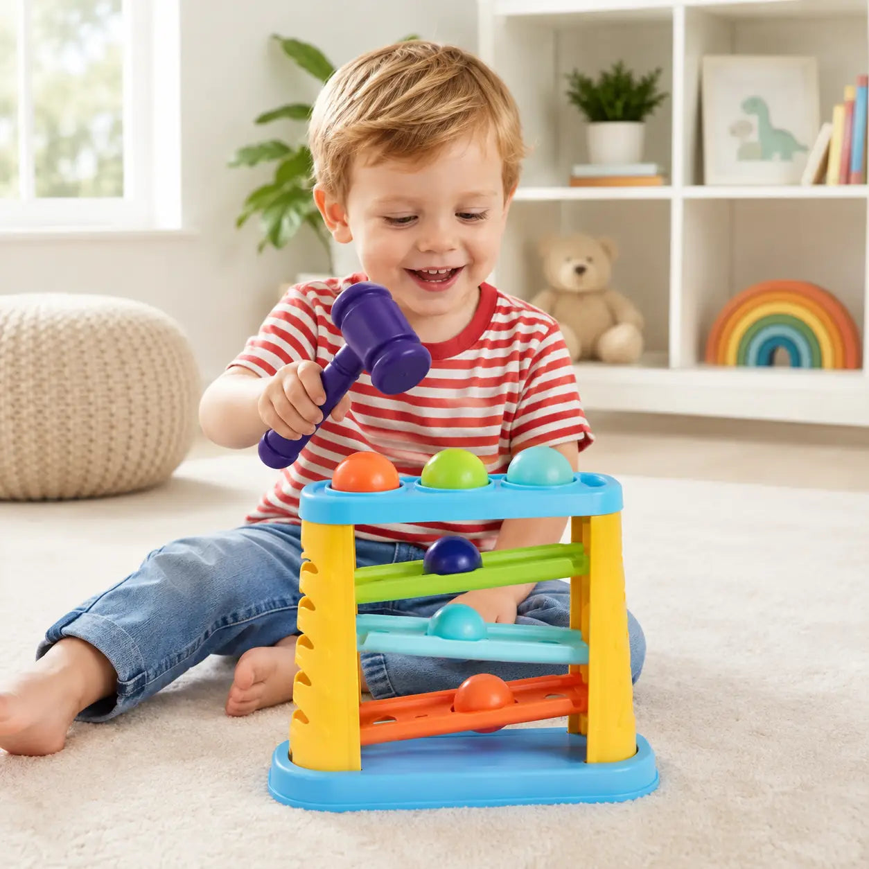 Hammering pounding ball toy features showing four colourful balls, three rolling ramps and toy hammer
