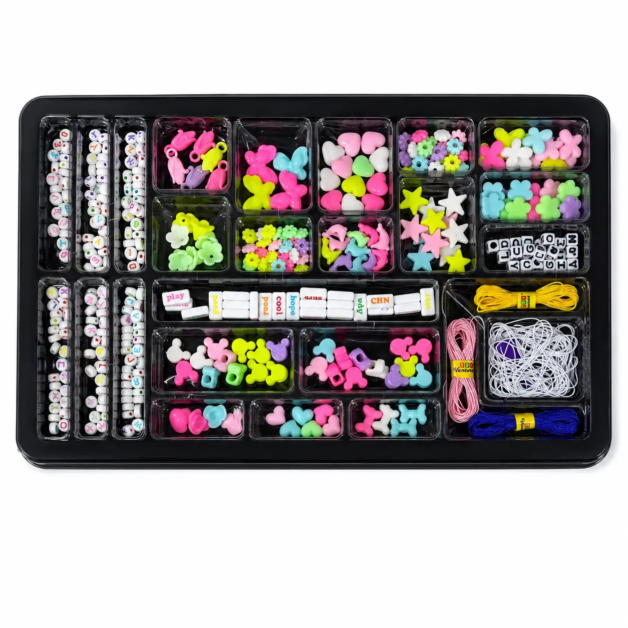 A black plastic organizer tray filled with colorful craft supplies, including beads, small charms, elastic bands, thread, and small packaged accessories, photographed on a plain white background.
