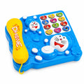 Blue Doraemon musical telephone toy with yellow corded handset and colourful learning buttons on a white background
