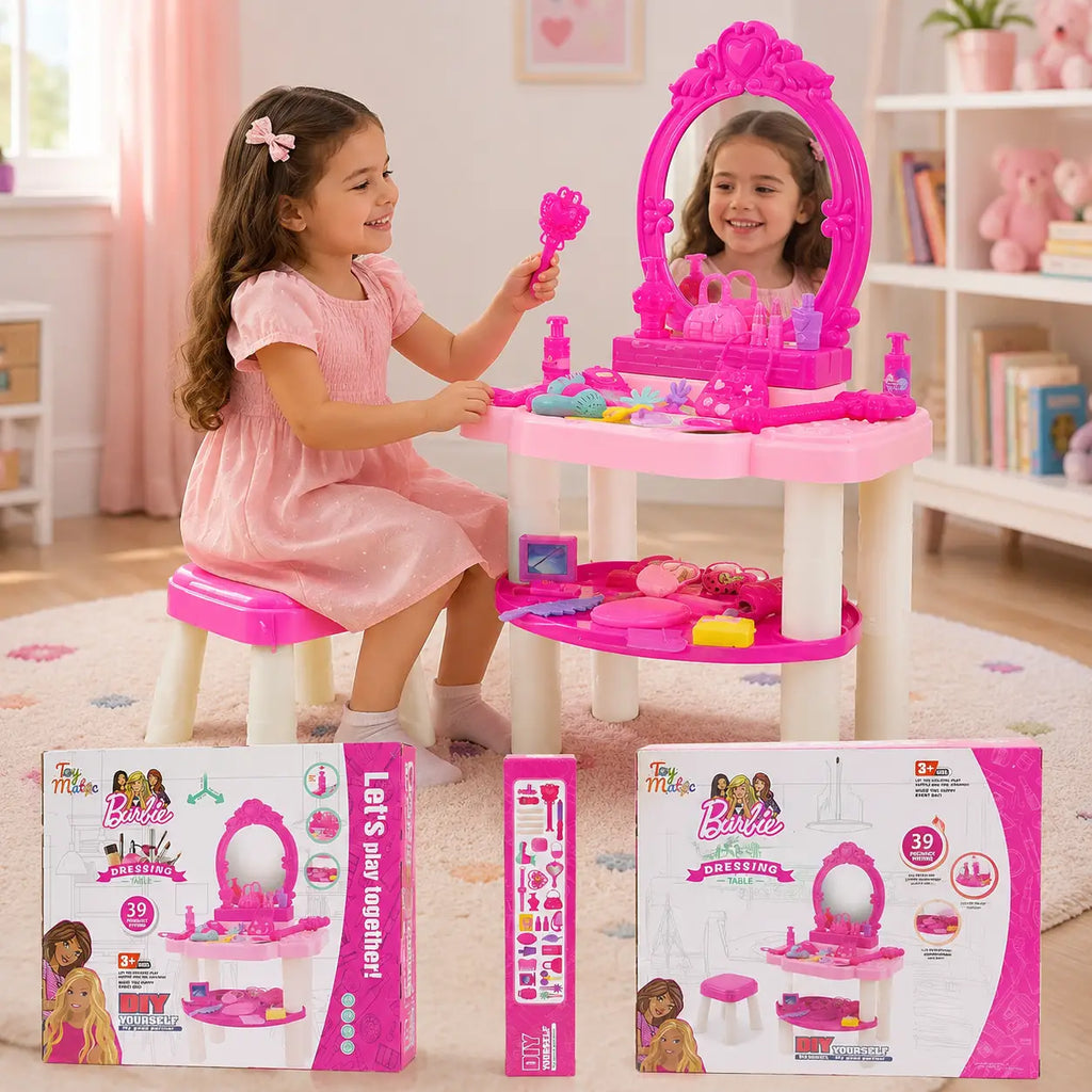 Young child playing with pink kids dressing table vanity set with mirror stool and pretend beauty accessories