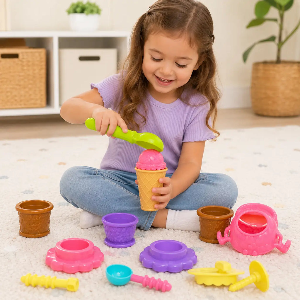 Young child playing with colourful Scoopy Fun pretend ice cream cones scoops and serving accessories