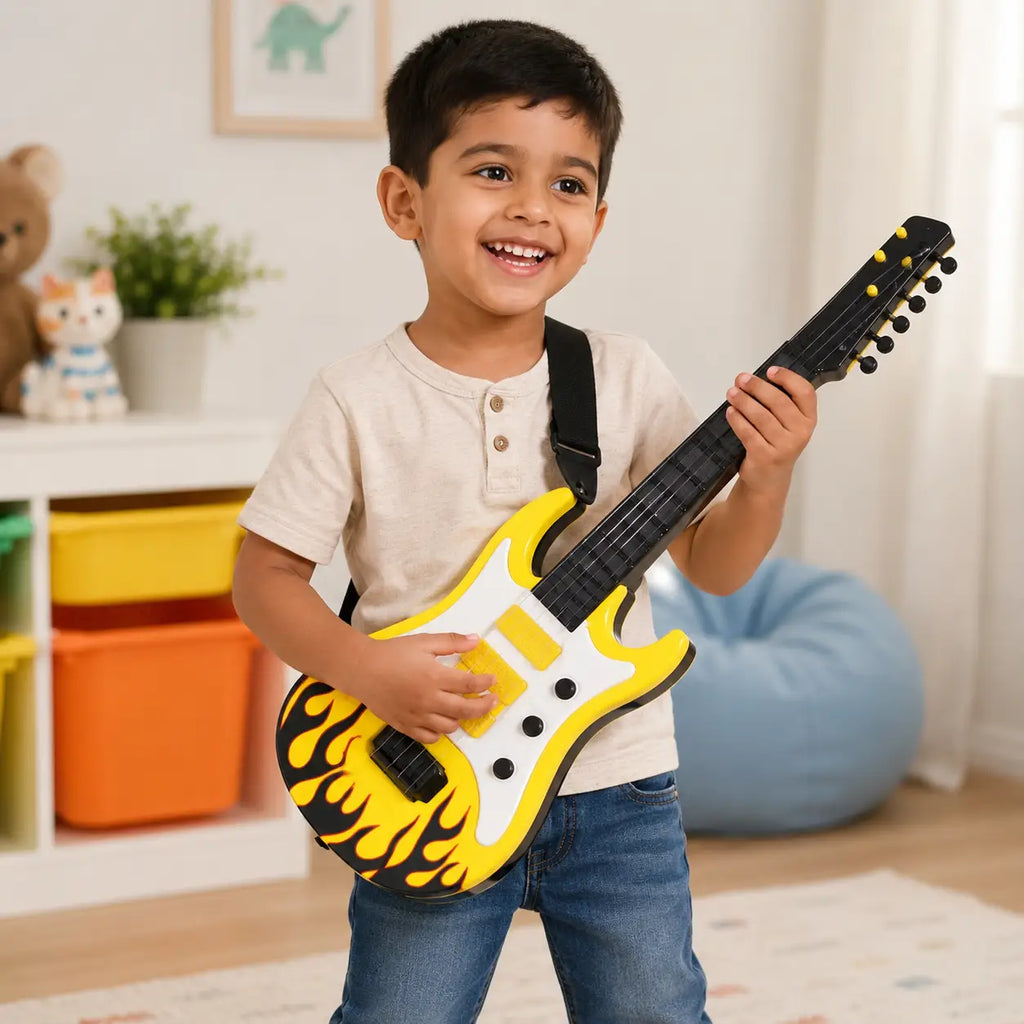 Child playing with yellow Rockband music guitar toy with flame design