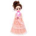Light-up princess fashion doll with peach lace dress and curly brown hair front view