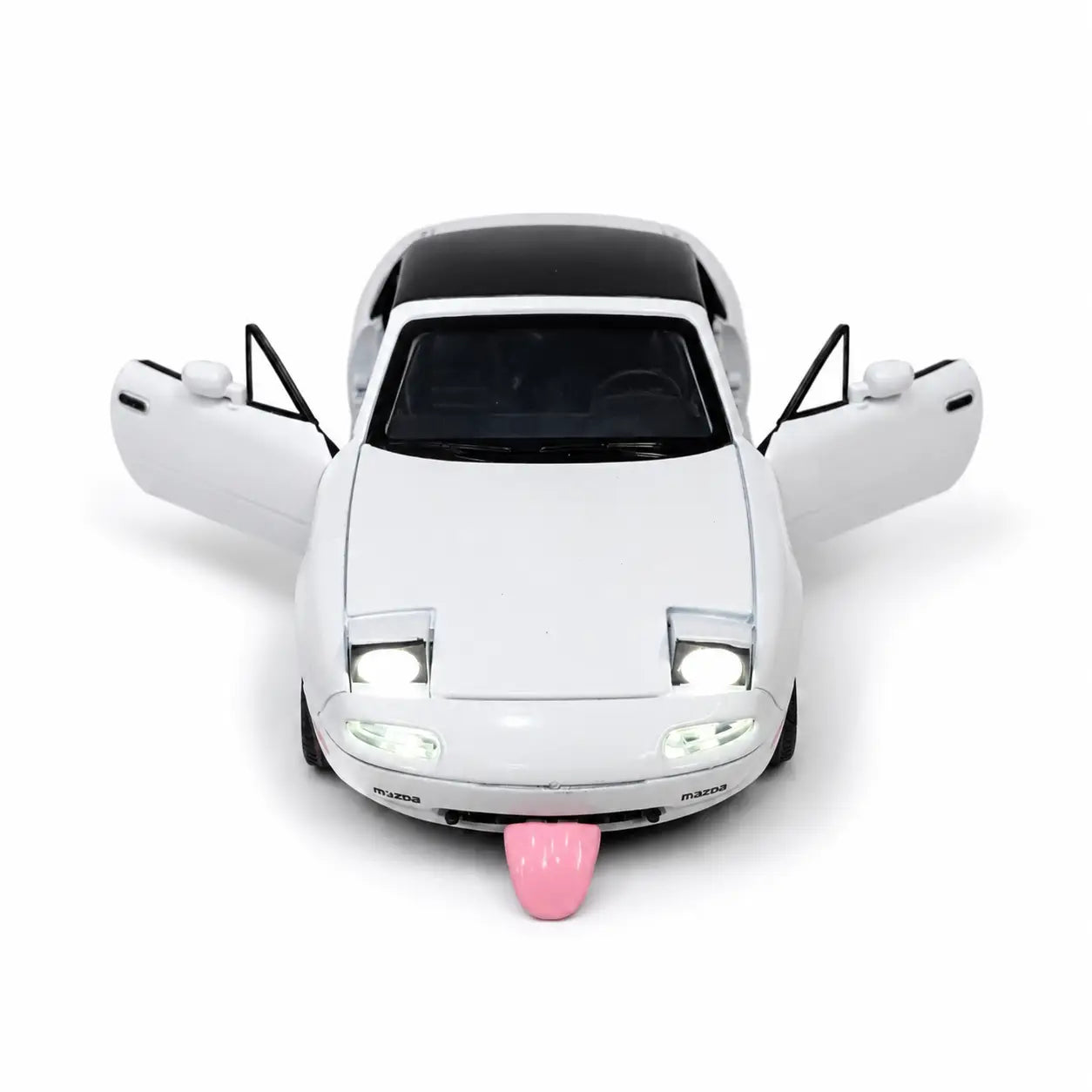 White Mazda MX-5 toy model with open doors, lights on and pink tongue-style feature