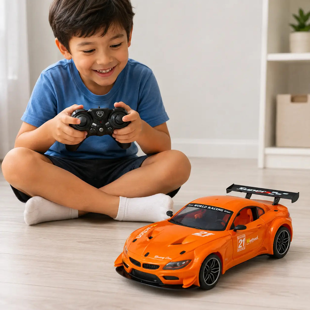 Child playing with orange rechargeable RC sports racing car using black remote controller