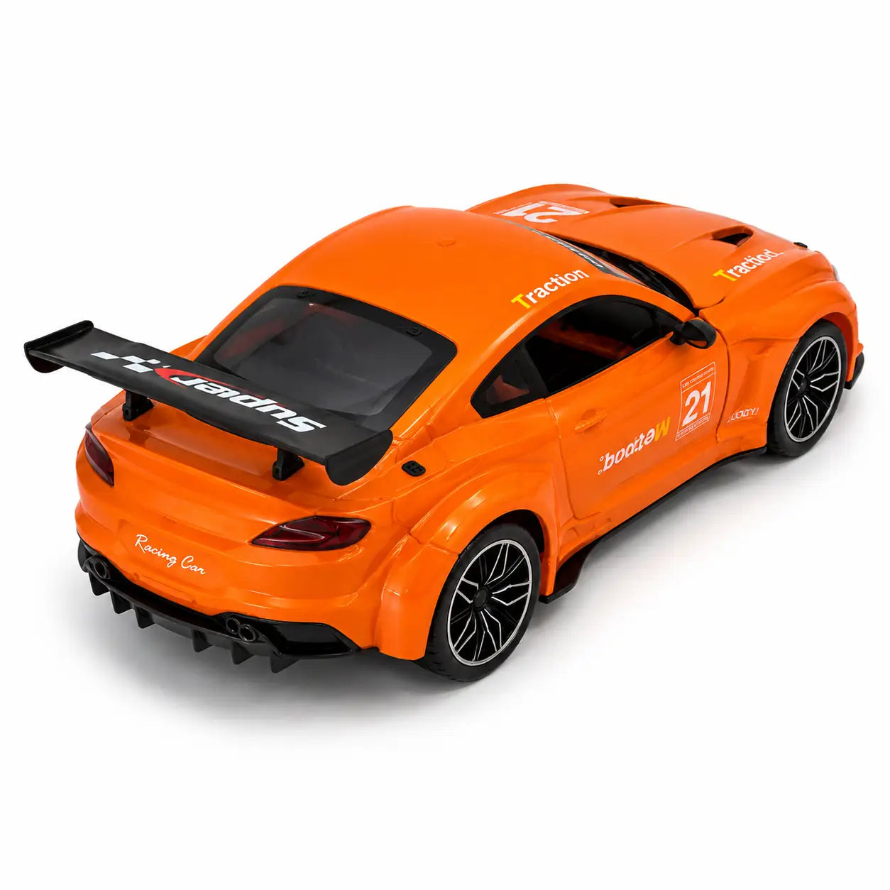 Rear three quarter view of orange remote control sports car showing black racing spoiler and wheels