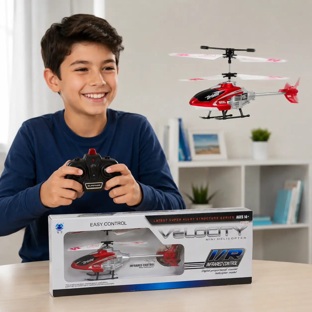 Child playing with Velocity infrared remote control mini helicopter using handheld controller indoors