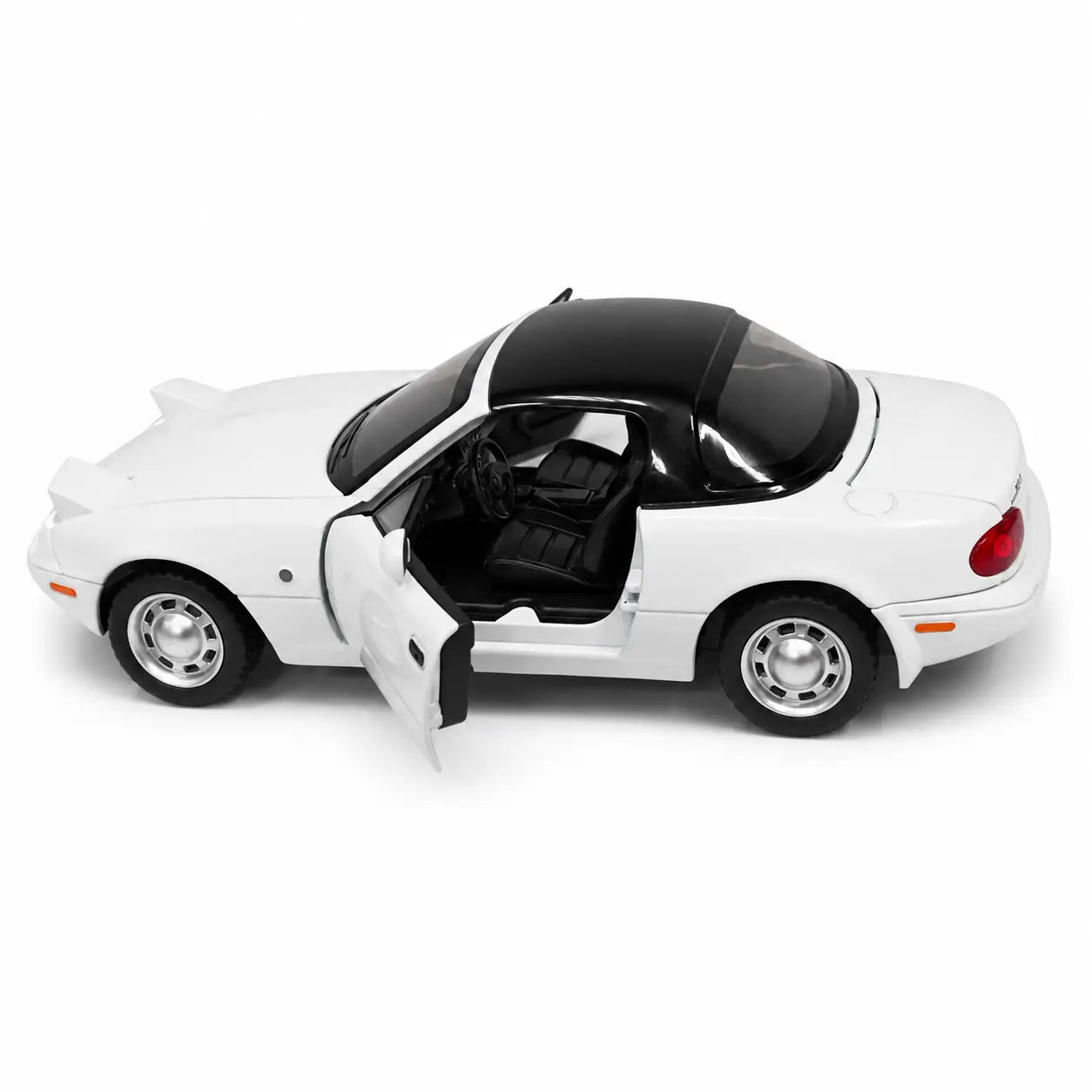 White Mazda MX-5 die-cast model car side view with open door and detailed interior