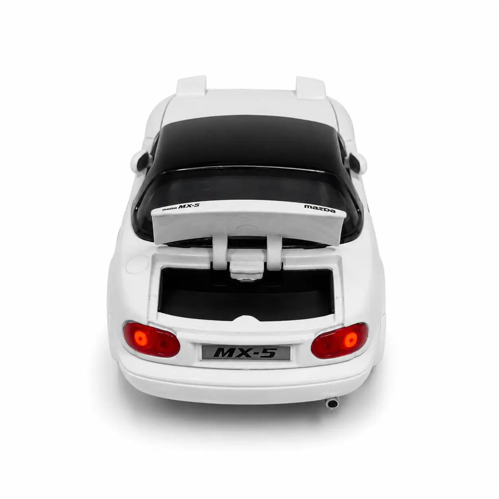 White Mazda MX-5 die-cast model car rear view with opening trunk