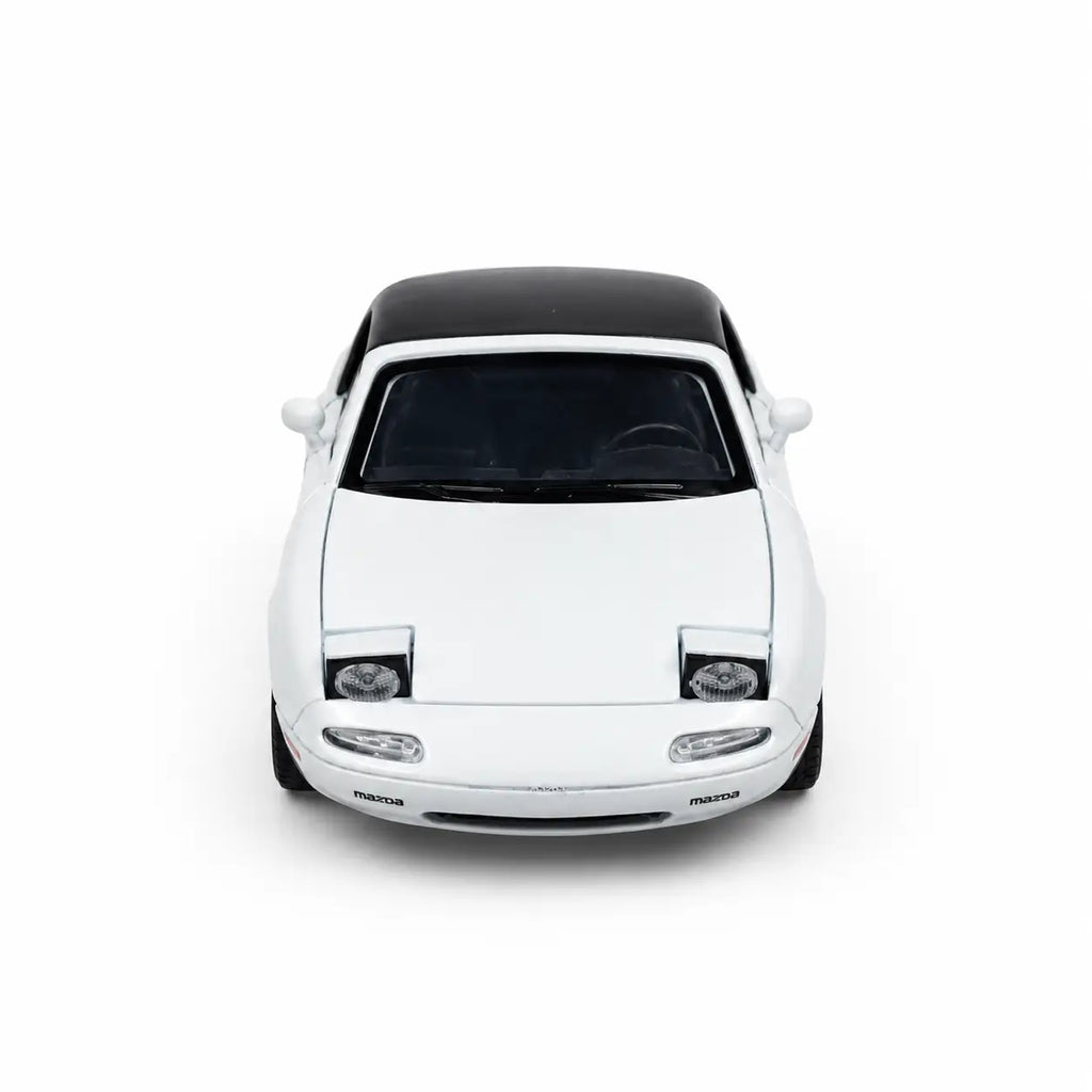 White 1:24 Mazda MX-5 die-cast model car front view with black roof