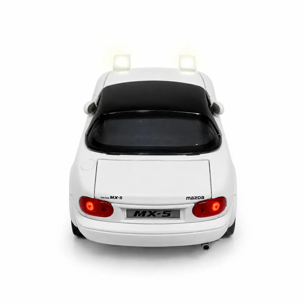 Rear view of white Mazda MX-5 model car with illuminated red lights
