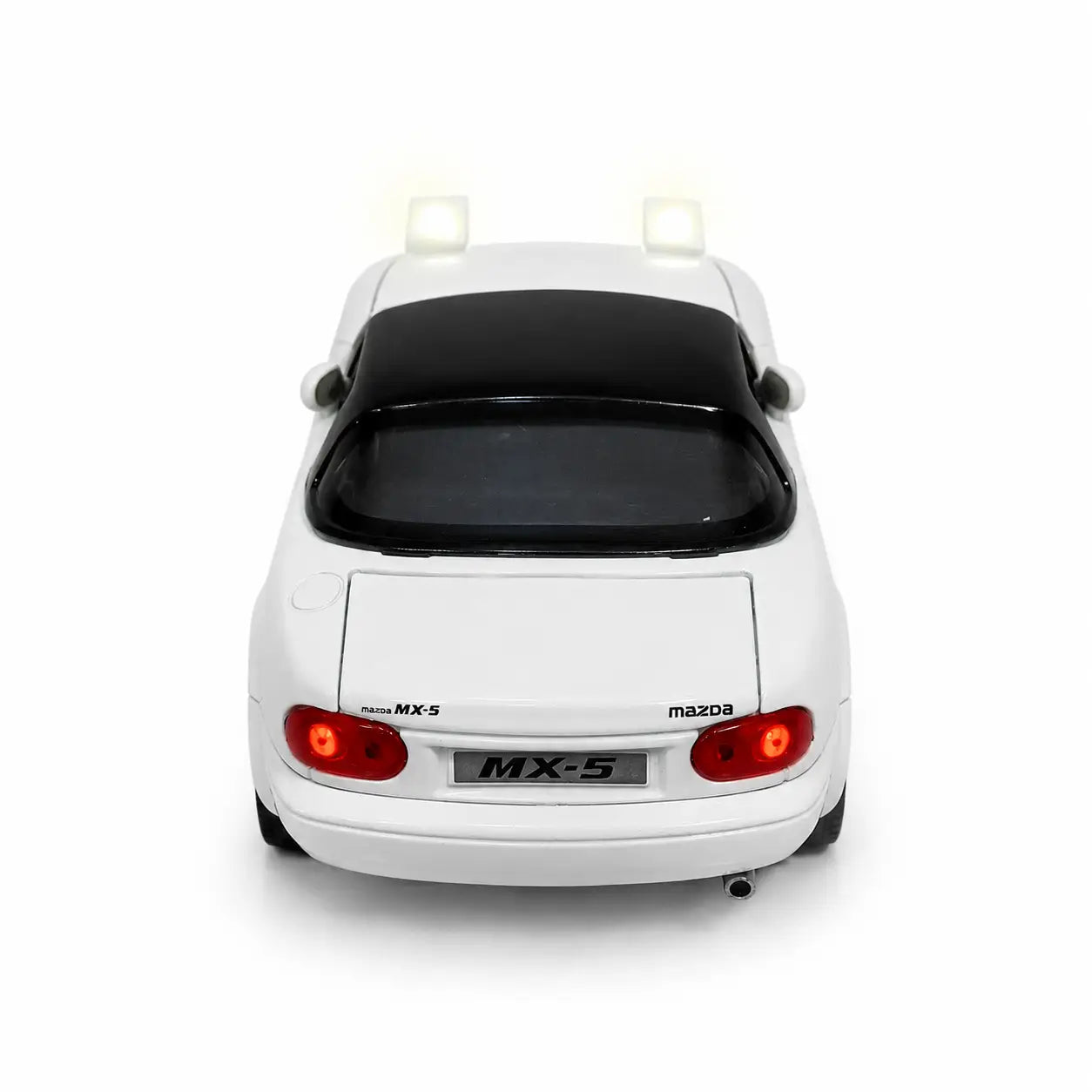 Rear view of white Mazda MX-5 model car with illuminated red lights